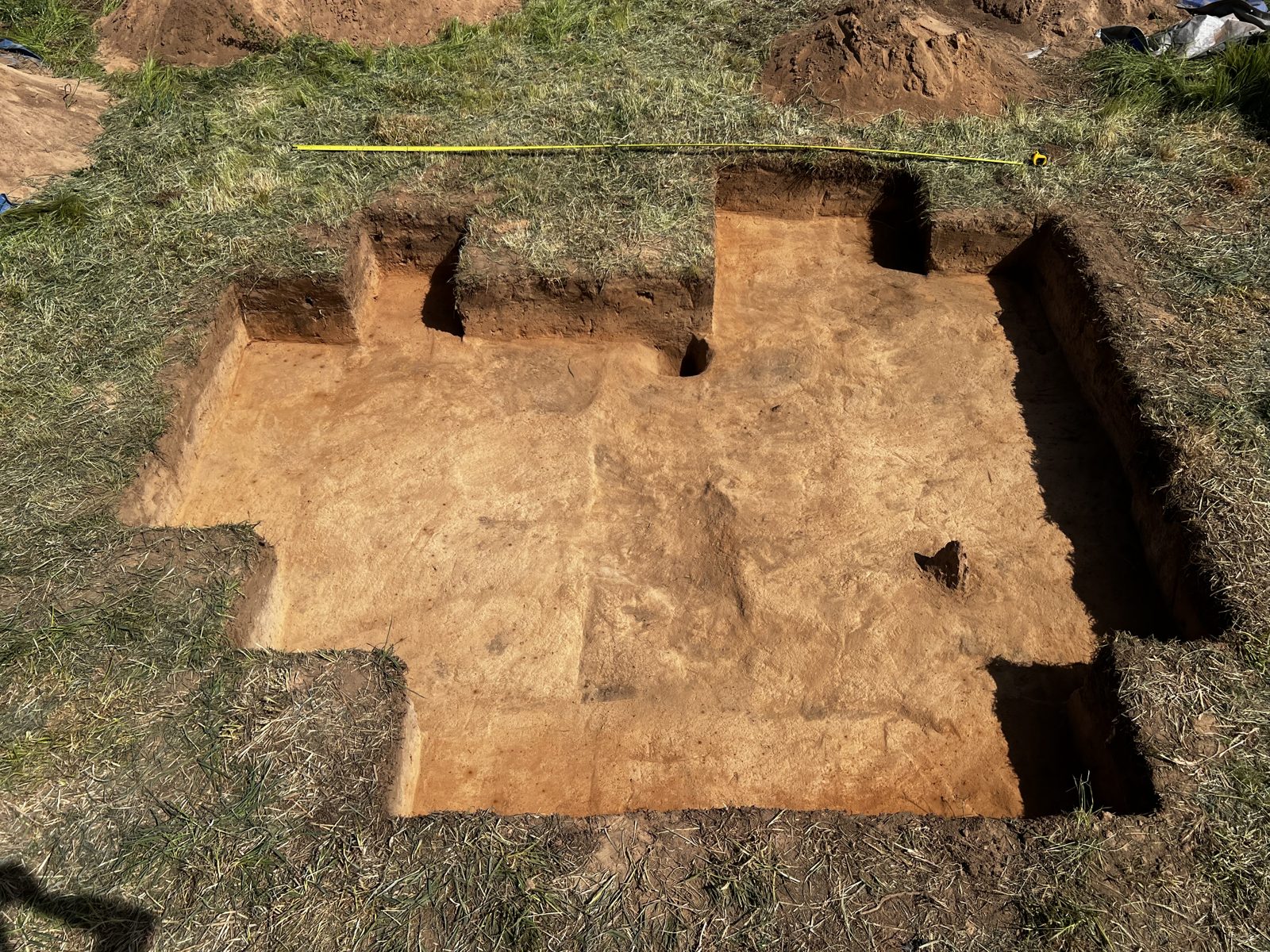 Aerial view of an open-area salvage excavation directed by COLCO
